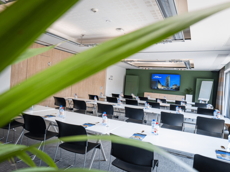 Meeting room at voco with bottles on table