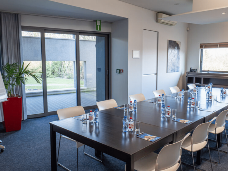 Meeting room at voco with bottles on table