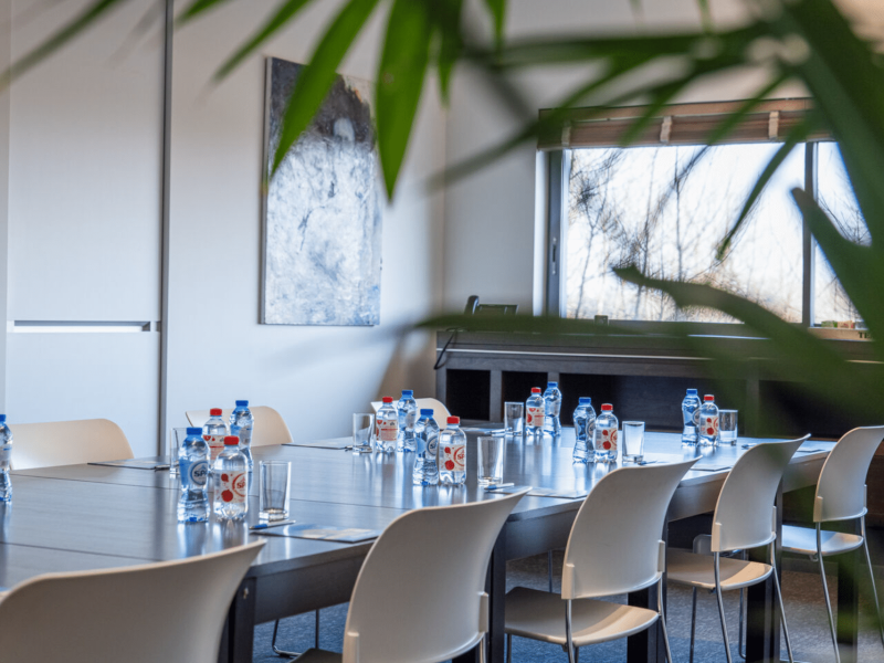 Meeting room at voco with bottles on table