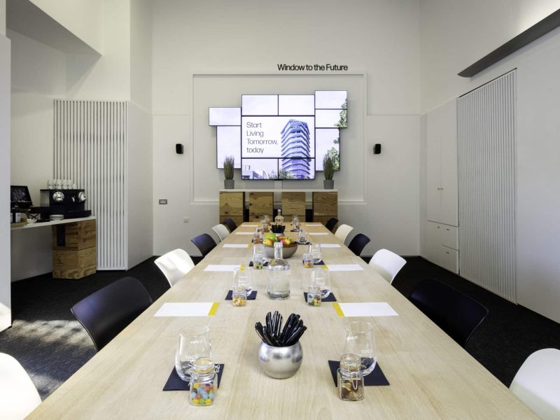 The Globe Meeting Room voco Brussels City North with funky tv screen, meeting stationary and a coffee corner
