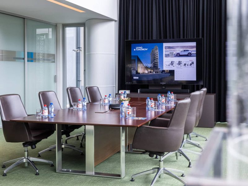 VIP Meeting Room at voco Brussels with bottles, tv screen