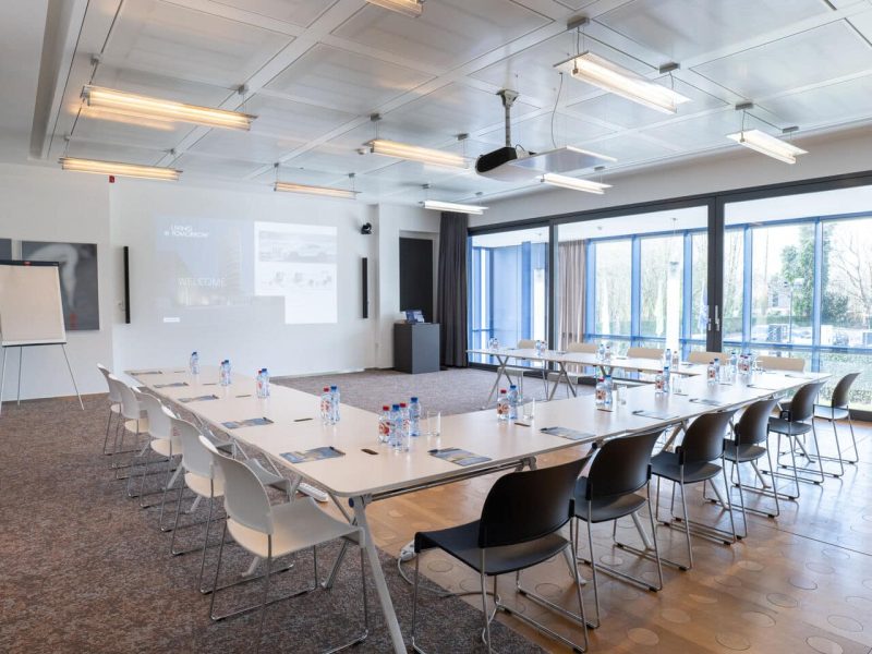 Vision Meeting Room at voco Brussels City North with U-shape and tv projection on the wall