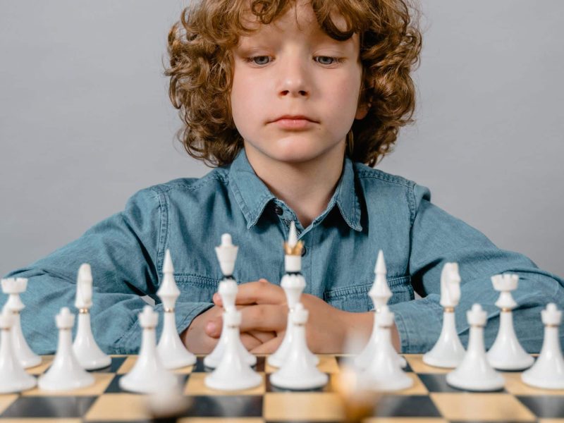boy concentrated on the chess game