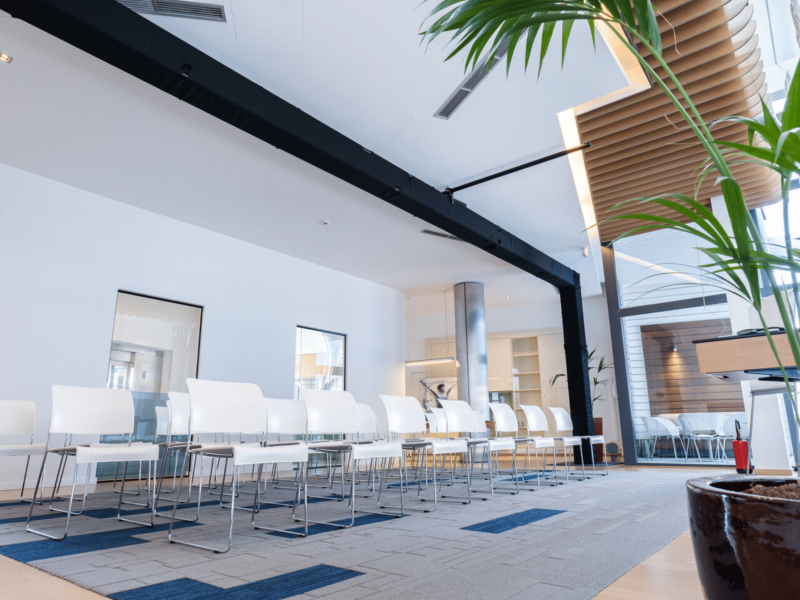 Meeting room at voco with green plant in the front
